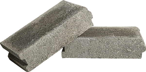 Bow-tie shaped interlocking pavers in red and grey